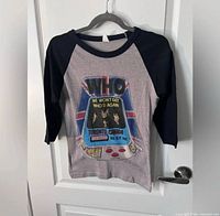 Full front view of tee on hanger