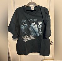 Full view of navy ZZ Top tour T-shirt on hanger