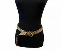Gold-tone braided belt on mannequin
