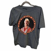 Full view of front of T-shirt on hanger