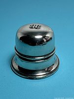 Overall view of domed silver plated Birks ring box