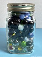 full jar of marbles front view