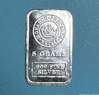 Front of Monarch Precious Metals 5 g .999 fine silver bar