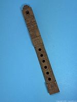 Full view of carved solid wood flute