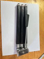 Tripod folded showing head, legs and handle