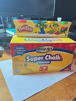 Exterior of RoseArt chalk box with Play-Doh pack on top