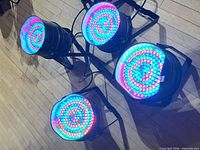 Four LED Par Cans illuminated showing RGB output