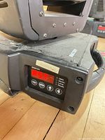 Control panel showing Martin branding, red LED display, DMX icons