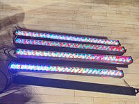 Four LED light bars illuminated on floor