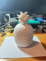 Full view of white porcelain pineapple jar assembled