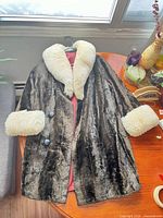 Full view of jacket laid flat on table showing exterior and lining