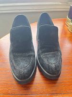Top view of both loafers showing suede uppers and stitching