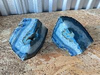 Both blue agate halves upright showing polished faces