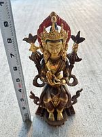 Front view with ruler showing ~9 inch height