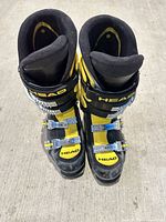 front view of both boots showing color, brand and buckles