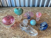 All eight glass items grouped on surface