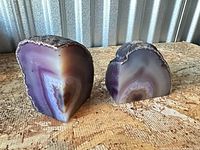 Front view of both agate sections showing polished faces and banding