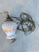 Full view of glass swag lamp with chain and cord