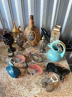 Overview of all vintage décor and tableware items arranged on surface