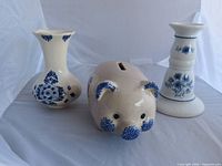 Group shot showing vase, piggy bank, and candlestick