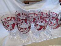 Eight red cut-to-clear crystal goblets grouped