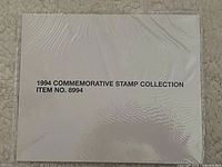 Factory-sealed white envelope labeled 1994 Commemorative Stamp Collection Item No. 8994