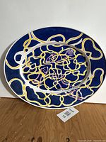 Front view of oval platter showing fish motif