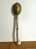 Full view of turtle shell rattle upright
