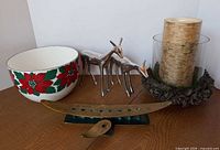 Group showing all items: menorah, Arabia bowl, two chrome deer, hurricane candle with wreath