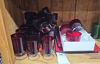 Group of ruby red Luminarc glassware showing tumblers, sherbets, bowls and plates