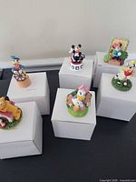 Six Lenox Disney character thimbles on individual white boxes