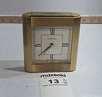 Front view of brass Tiffany & Co. desk clock showing dial and case