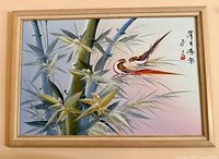 Full view of framed oil painting showing birds and bamboo composition