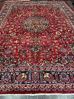 Full view of Mashhad rug showing entire pattern and borders