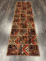 Full view of entire runner rug on dark floor