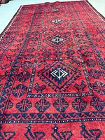 Full view of Baluchi rug showing overall pattern and dimensions