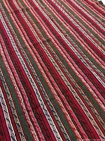 Full perspective view showing striped pattern and weave