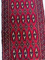 Close-up of pile side displaying gul motifs and weave detail