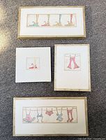 Front view of all four canvases showing motifs and relative sizes