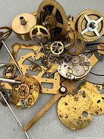 Pile of brass gears, plates and arbors