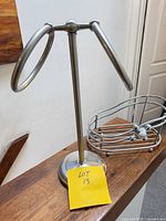 Full view of metal towel stand and caddy on counter