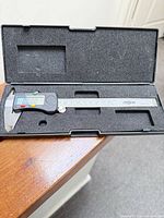Caliper in open foam-lined case