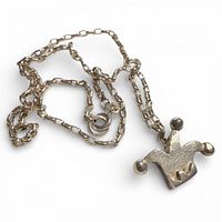 Full view of sterling chain and jester hat pendant