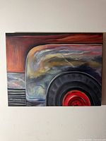 Front view of completed oil painting depicting truck wheel