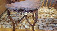 Overall view of carved accent table front angle