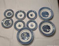 Group shot showing all nine blue transferware pieces