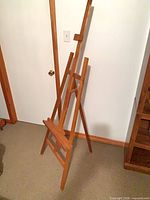 Front view of pine A-frame easel showing tray and center mast
