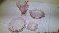 All four pink Depression glass pieces in one view