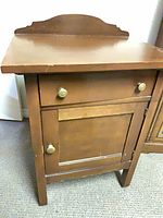Front view of nightstand showing drawer and cabinet door