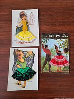 Front view of all three fabric-embellished flamenco dancer postcards